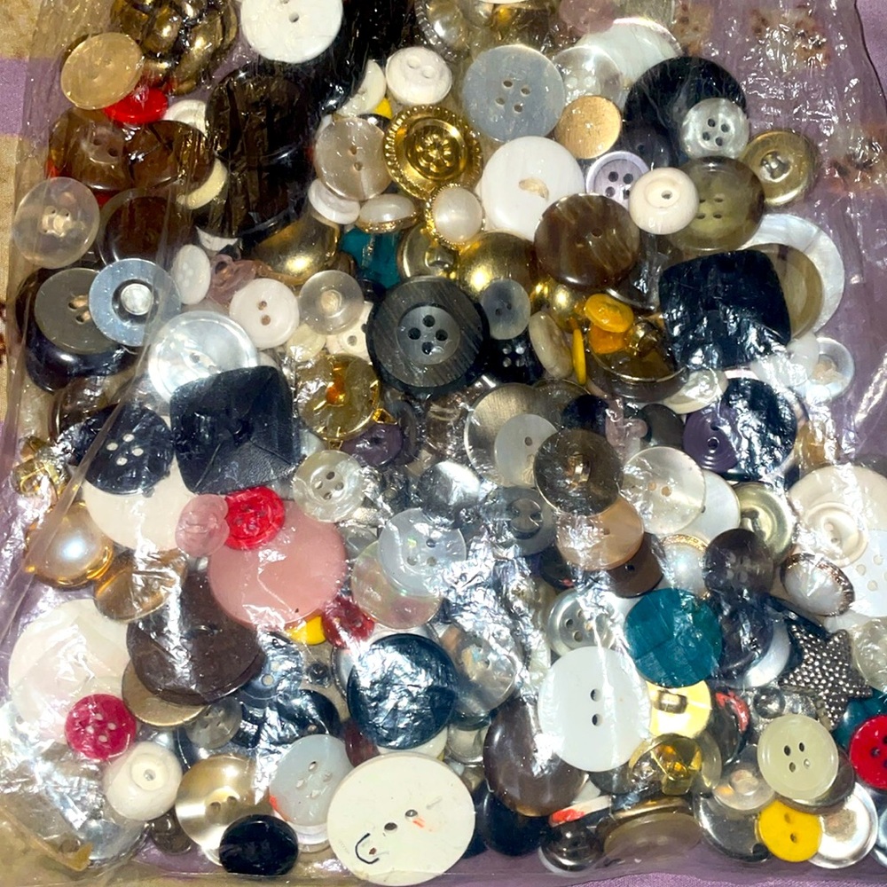 Assorted bag of vintage buttons.